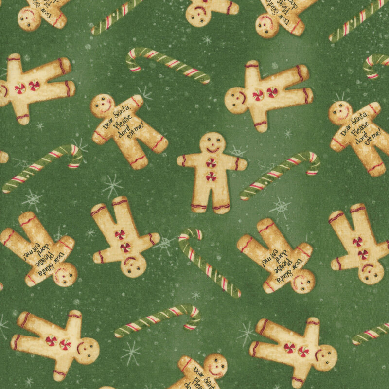 snowflake covered green fabric adorned with scattered green candy canes and gingerbread cookies