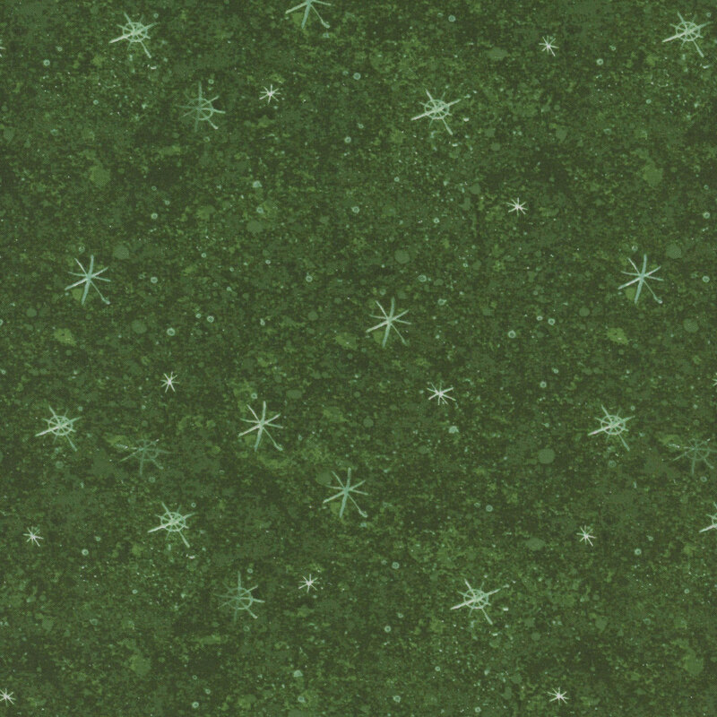 snowflake covered forest green fabric