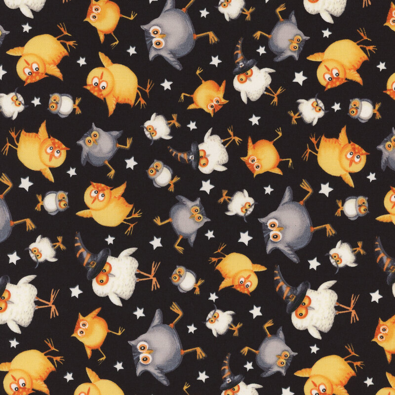 delightful black fabric with scattered white stars and adorable little owls
