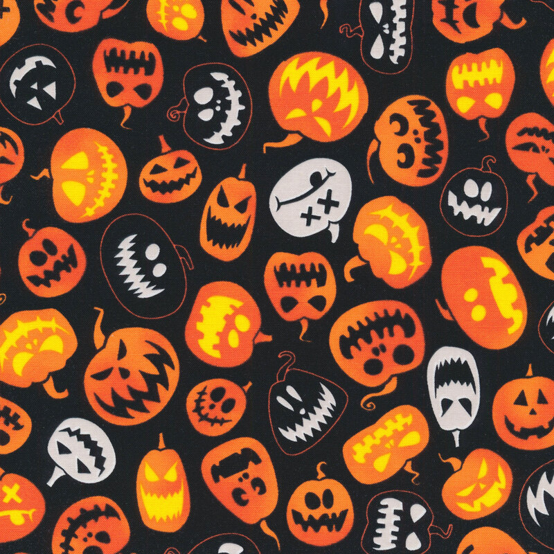 fabric featuring orange, white and black jack o' lanterns on a black background