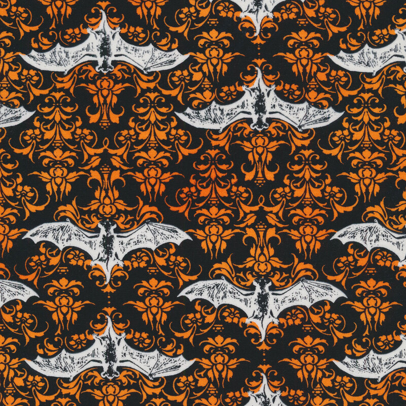 fabric featuring white bats and orange damask designs on a black background