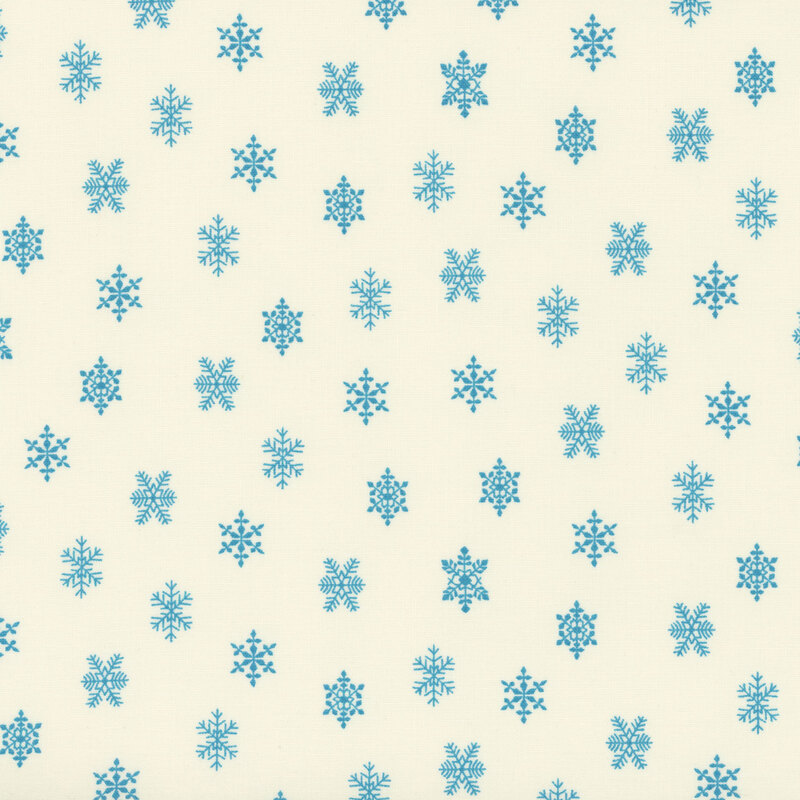 lovely cream fabric featuring scattered light blue snowflakes