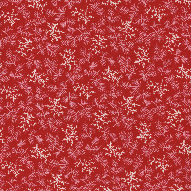 lovely red fabric featuring scattered white evergreen branches