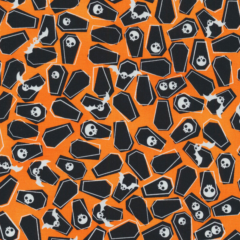 fabric featuring scattered coffins, bats and skulls on a orange background