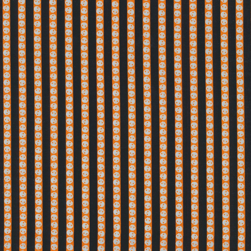 fabric featuring black and orange stripes with skulls