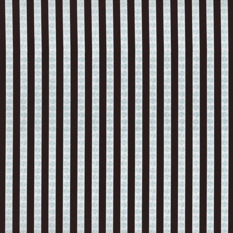 fabric featuring black and white stripes with skulls
