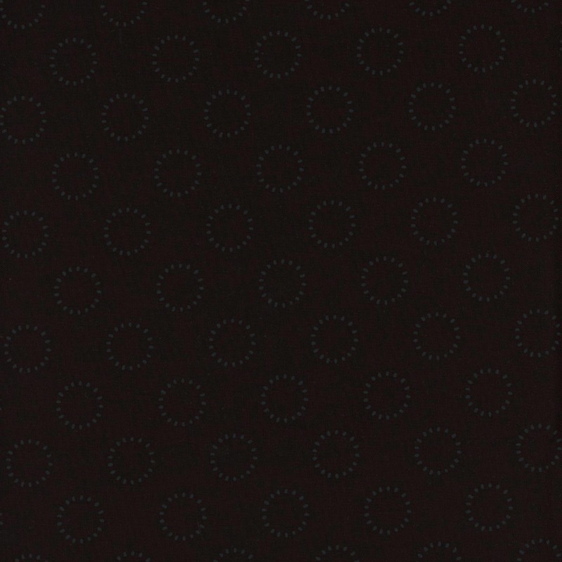 Tonal black fabric with polka dot circle outlines made up of tiny dots