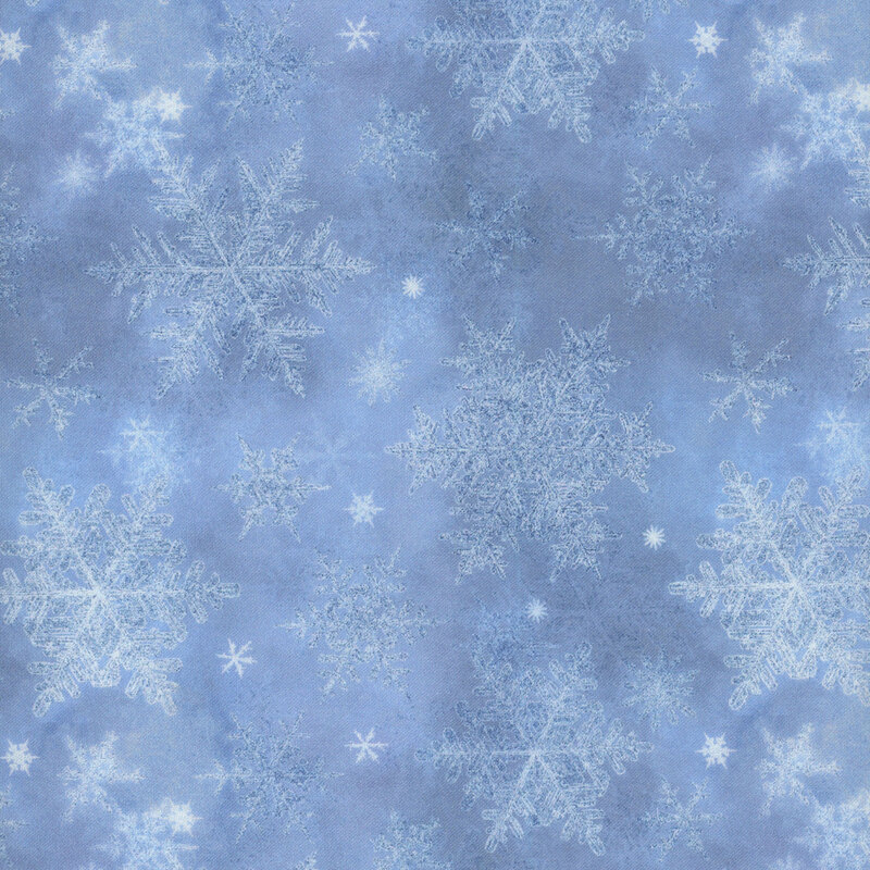 light blue mottled fabric featuring scattered tonal snowflakes