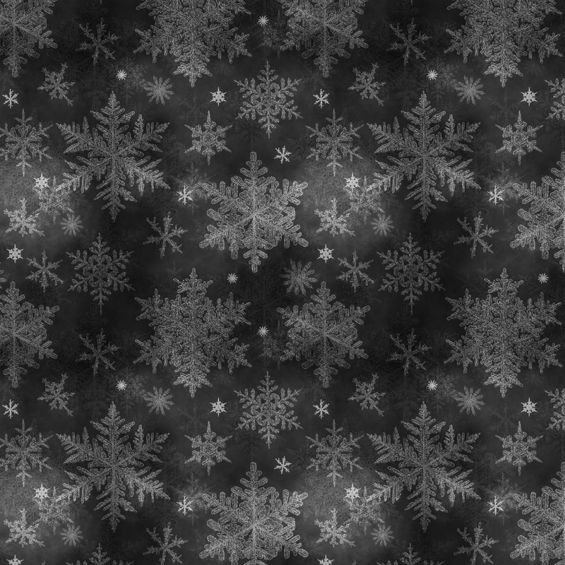 mottled black fabric featuring scattered gray and white snowflakes