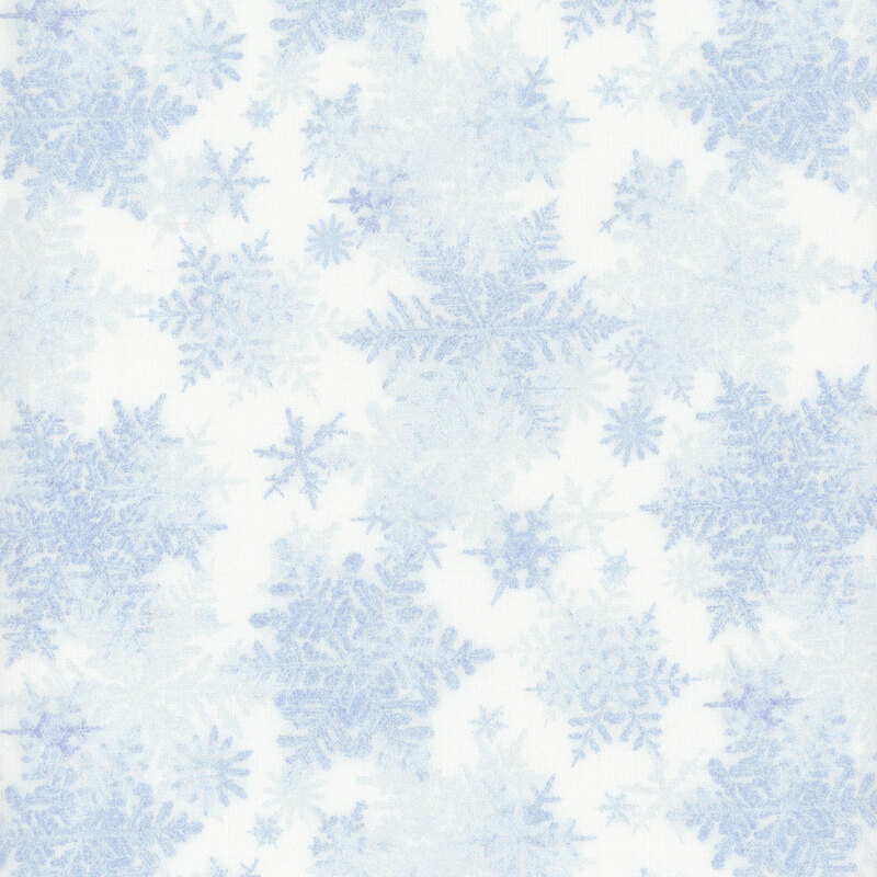 white fabric featuring scattered light blue snowflakes