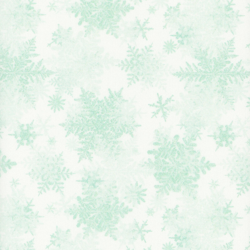 white fabric featuring scattered light mint snowflakes