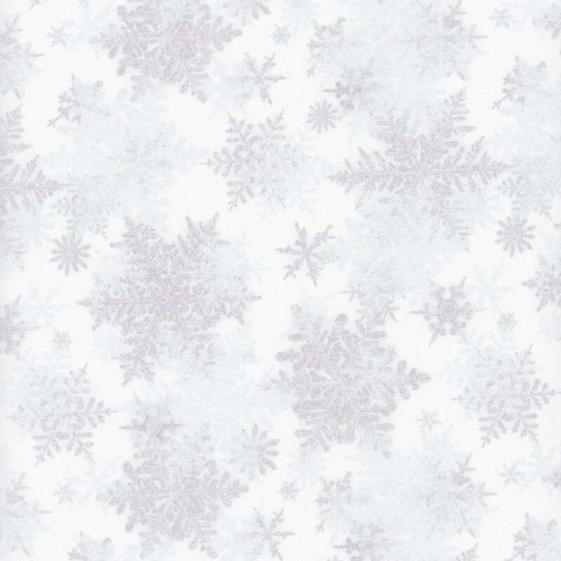 white fabric featuring scattered light gray snowflakes