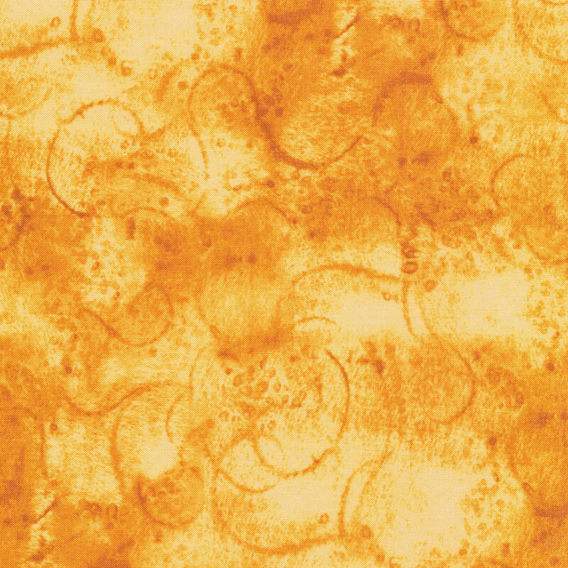 fabric featuring watercolor swirls on a golden yellow mottled background