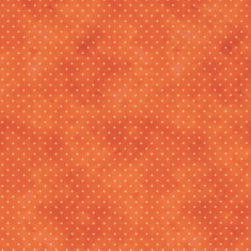 bright orange mottled fabric with light orange polka dots