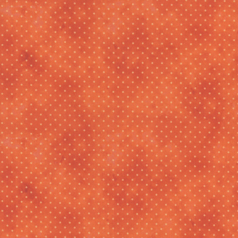 orange mottled fabric with light orange polka dots
