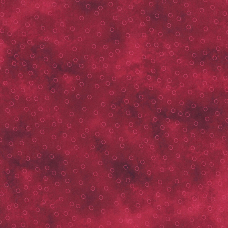 dark pink mottled fabric with scattered hot pink circle outlines