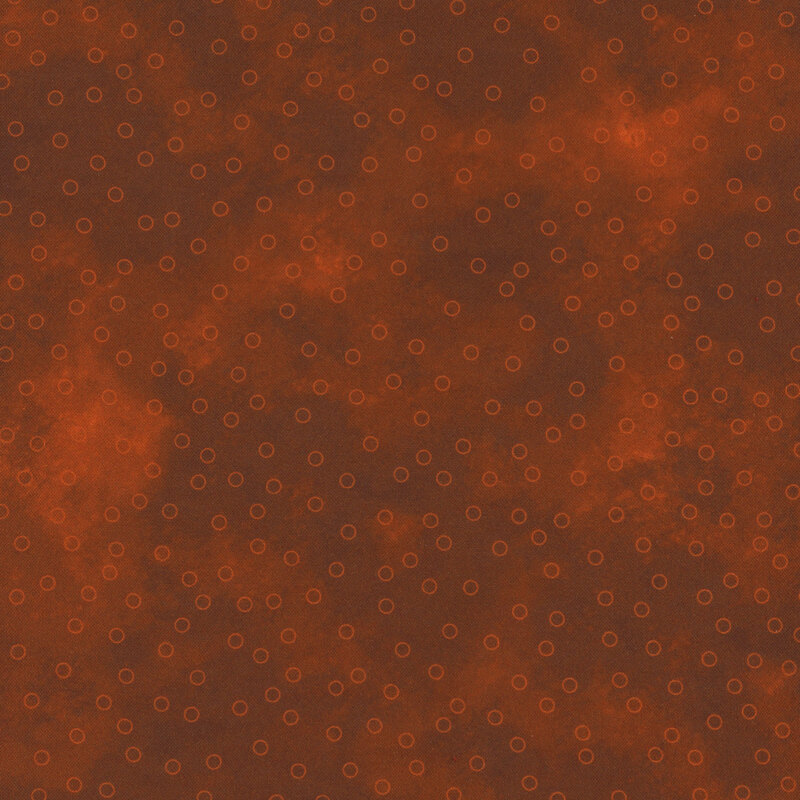 burnt orange mottled fabric with scattered orange circle outlines