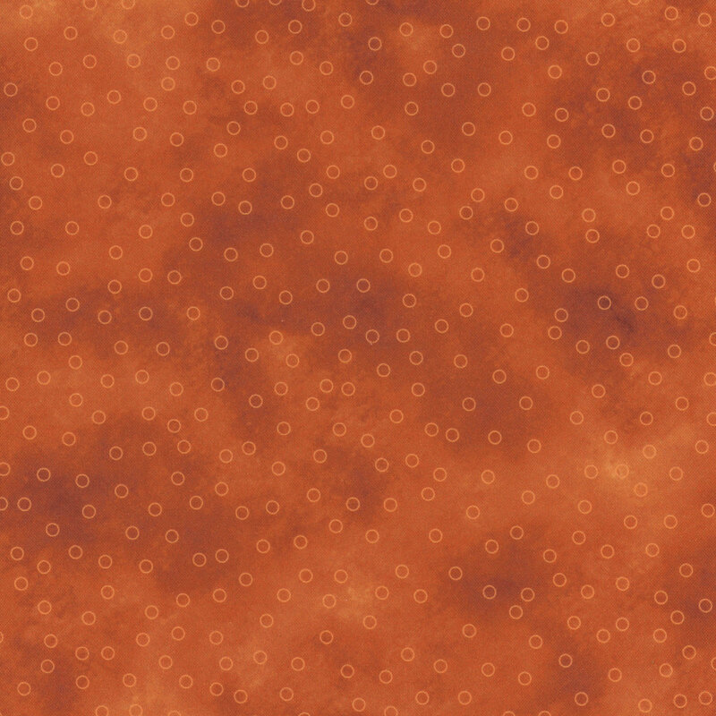 orange mottled fabric with scattered light orange circle outlines