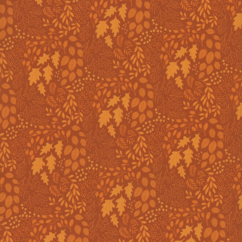 tonal fabric with various types of leaves in shades of orange