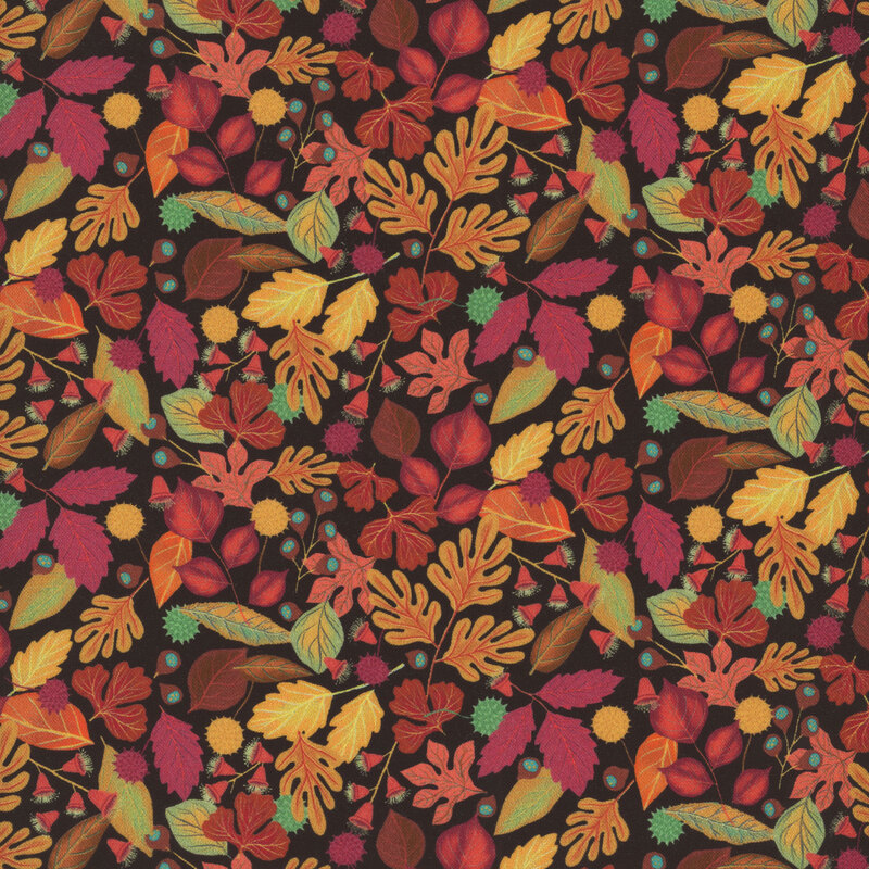 fabric featuring various leaves in shades of purple, yellow, brown, and blue on a black background