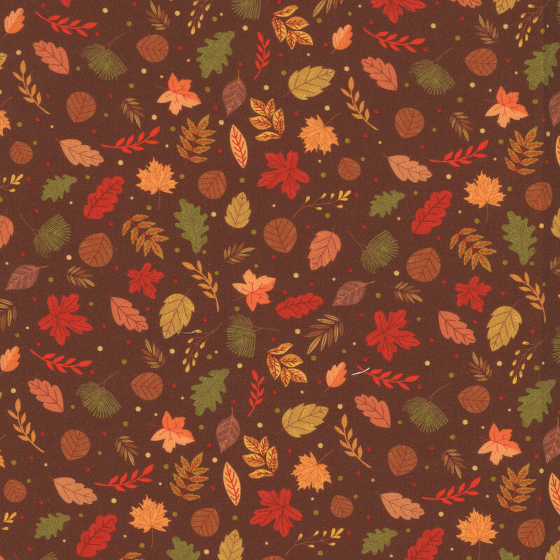 fabric featuring various green, red, brown, and orange leaves on a brown background