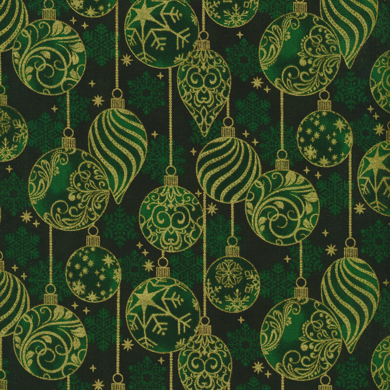 forest green fabric featuring scattered green snowflakes overlaid by metallic gold Christmas ornaments