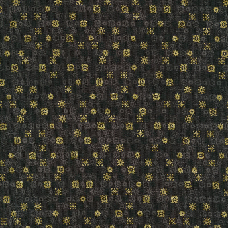 black fabric featuring rows of geometric gray and metallic gold snowflakes