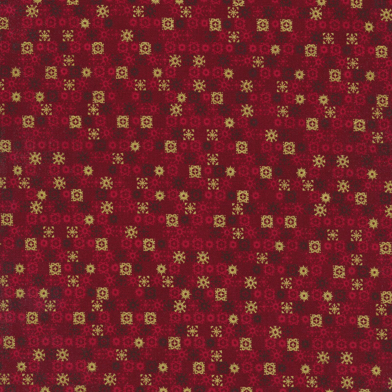 rich red fabric featuring rows of geometric burgundy, pale red, and metallic gold snowflakes