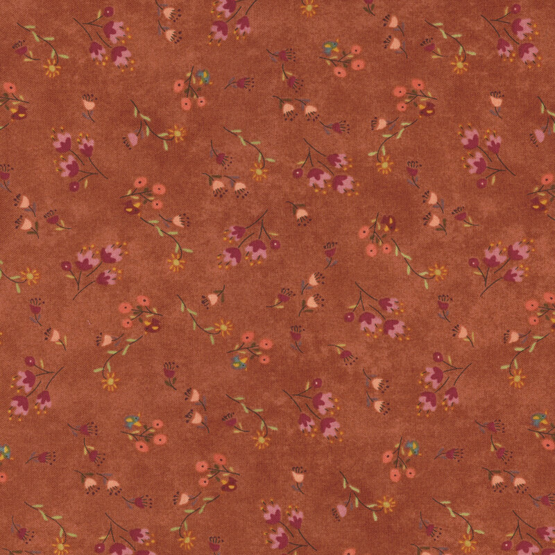 Mauve fabric covered with tossed wildflowers