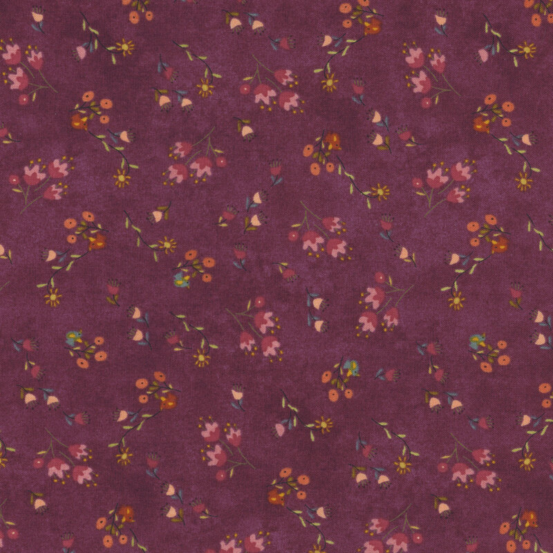 Purple fabric covered with tossed wildflowers