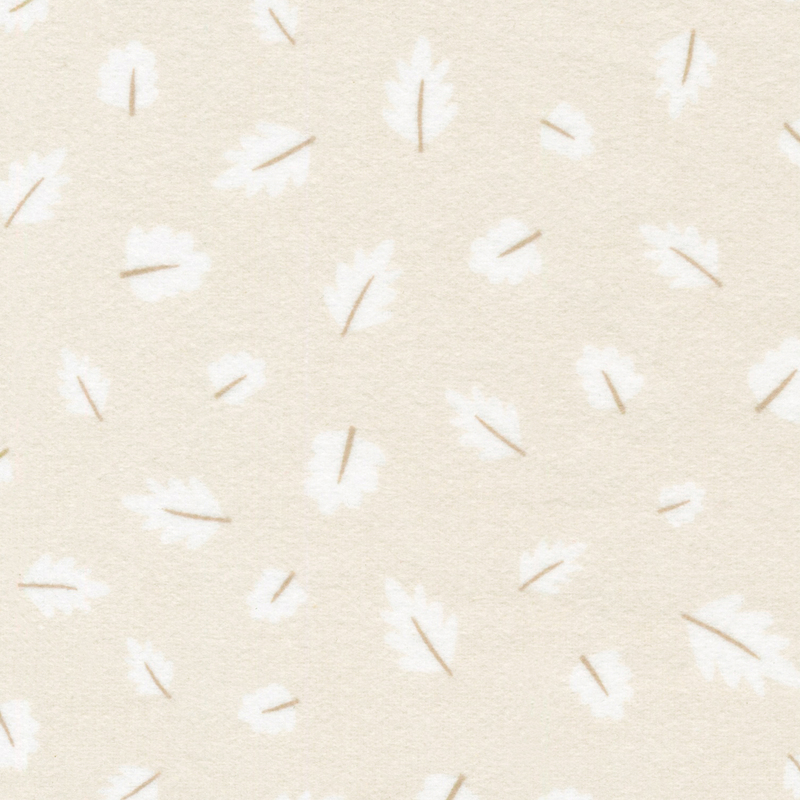 light beige flannel fabric featuring scattered white leaves