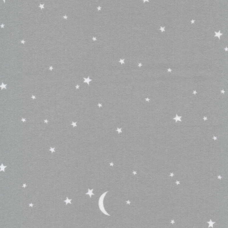 gray flannel fabric featuring scattered white stars and crescent moons