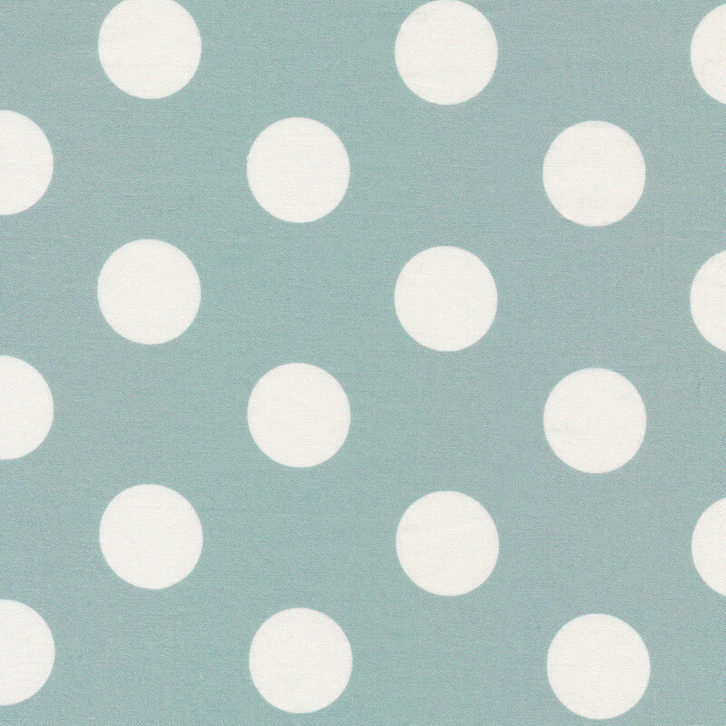 light teal fabric featuring white polka dots