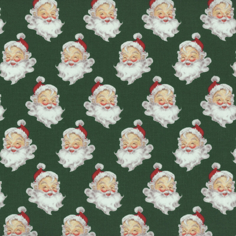 Green fabric with a pattern of portraits of Santa Claus.