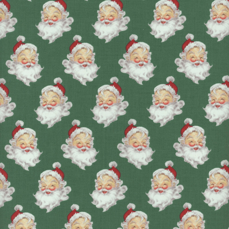 Green fabric with a pattern of portraits of Santa Claus.