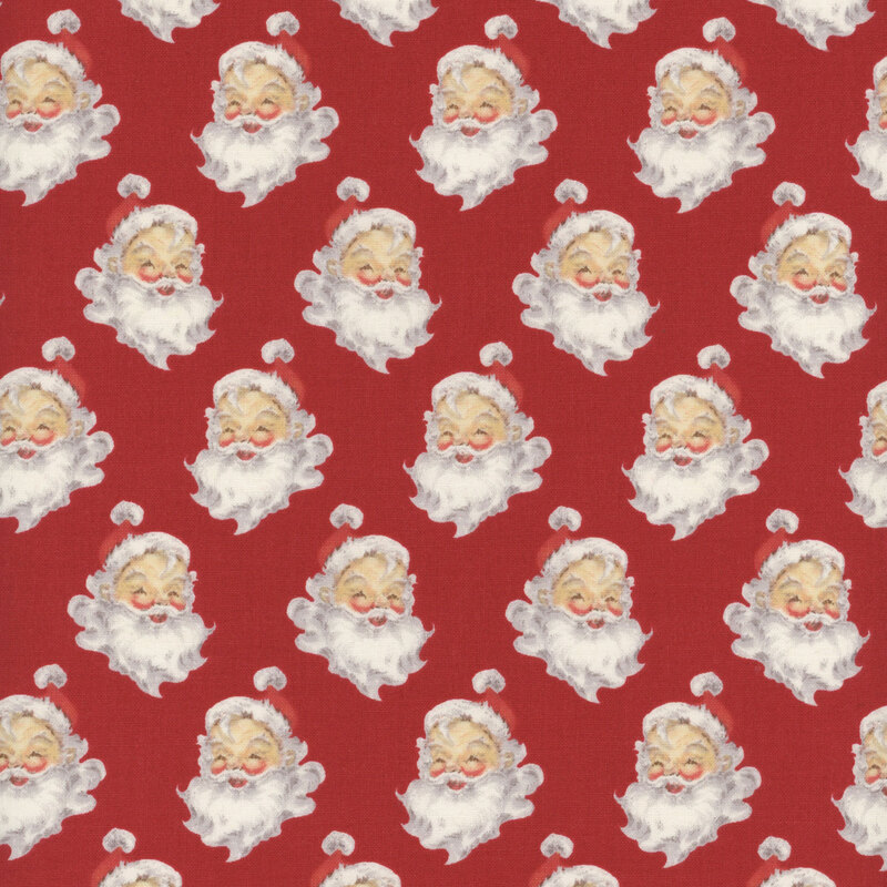 Red fabric with a pattern of portraits of Santa Claus.