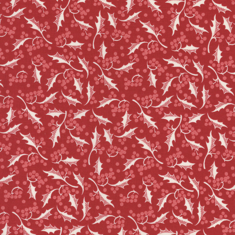 Red fabric with a pattern of holly leaves and berries.