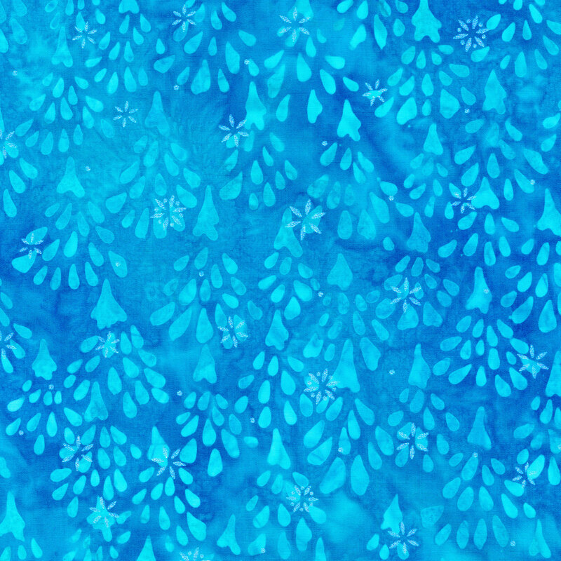 bright blue mottled fabric featuring impressionistic aqua fir trees, accented with metallic silver snowflakes