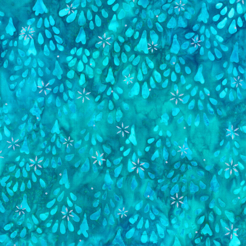 teal mottled fabric featuring impressionistic aqua fir trees, accented with metallic silver snowflakes