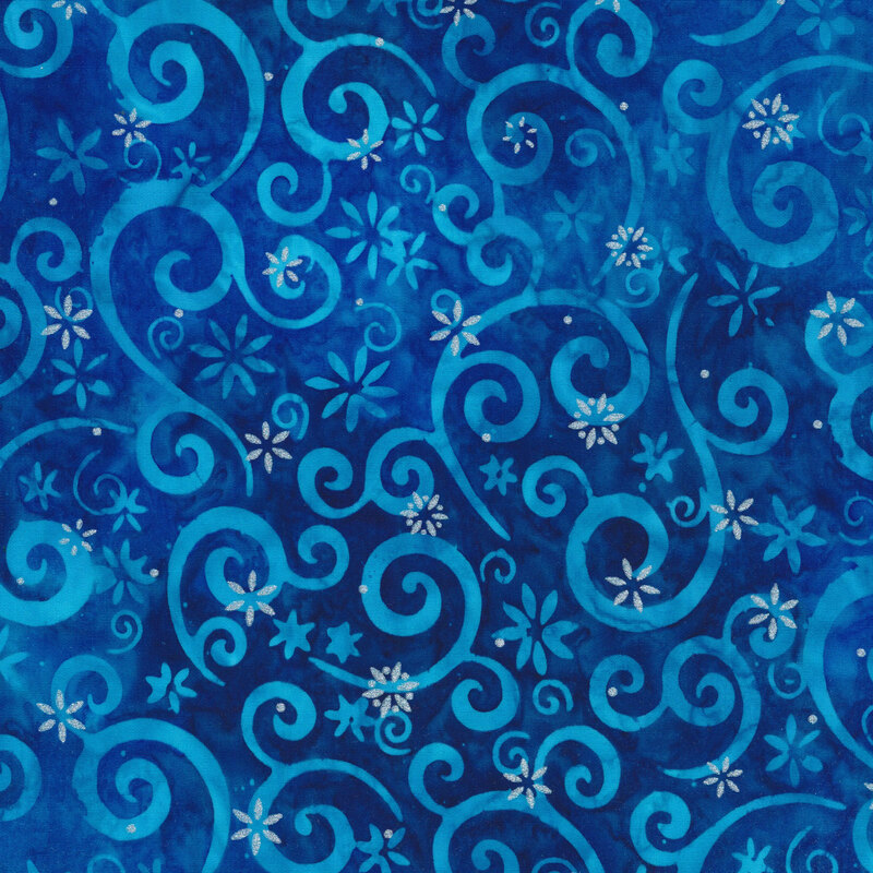 royal blue mottled fabric featuring light blue swirling scrolls and snowflakes, accented with metallic silver snowflakes