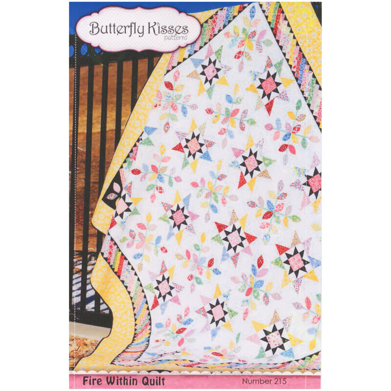 Front cover of pattern showing the finished quilt in bright warm tones, staged on a wrought iron fence outdoors