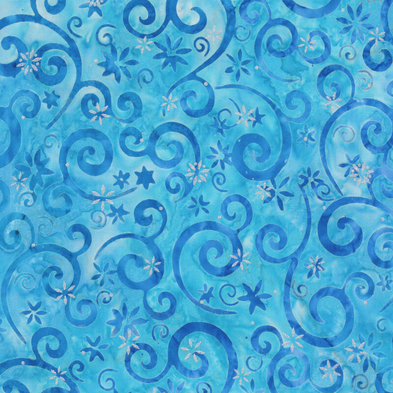light blue mottled fabric featuring darker blue swirling scrolls and snowflakes, accented with metallic silver snowflakes