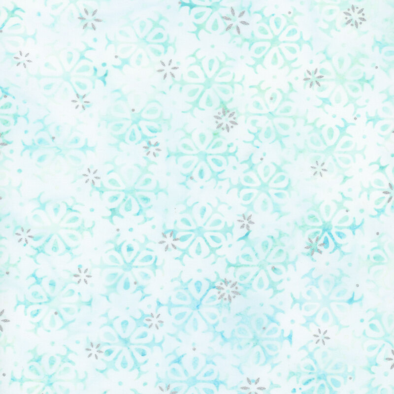 lightly cyan-mottled white fabric featuring alternating rows of light teal and light blue snowflakes, accented with metallic silver snowflakes