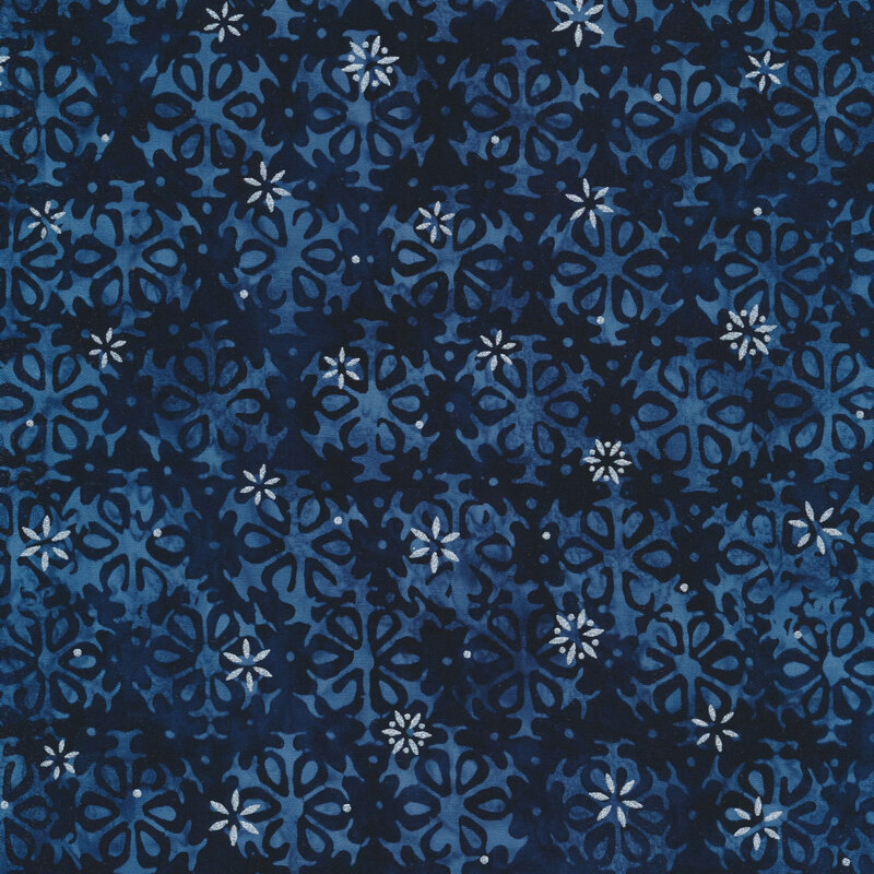 dark navy blue mottled fabric featuring alternating rows of faded blue snowflakes, accented with metallic silver snowflakes