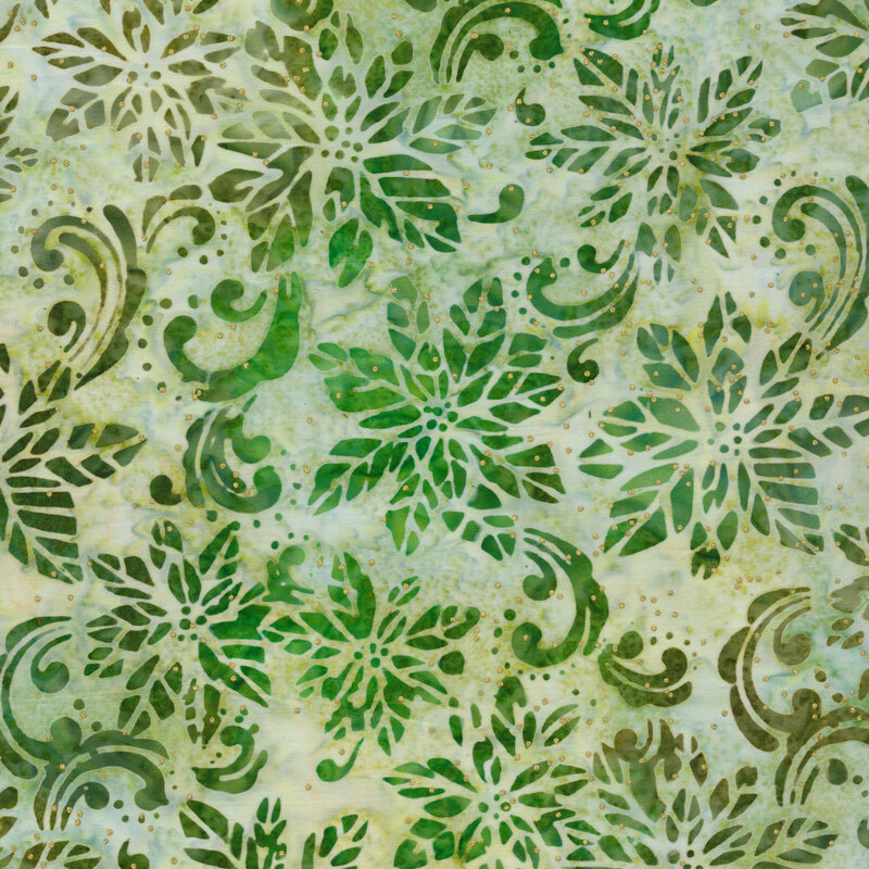 Green mottled batik fabric with a green poinsettia design and swirls with gold metallic dots.