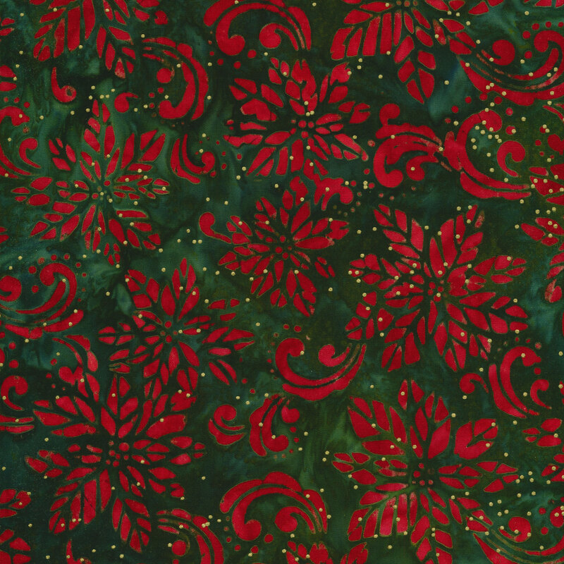 Green mottled batik fabric with a red poinsettia design and swirls with gold metallic dots.