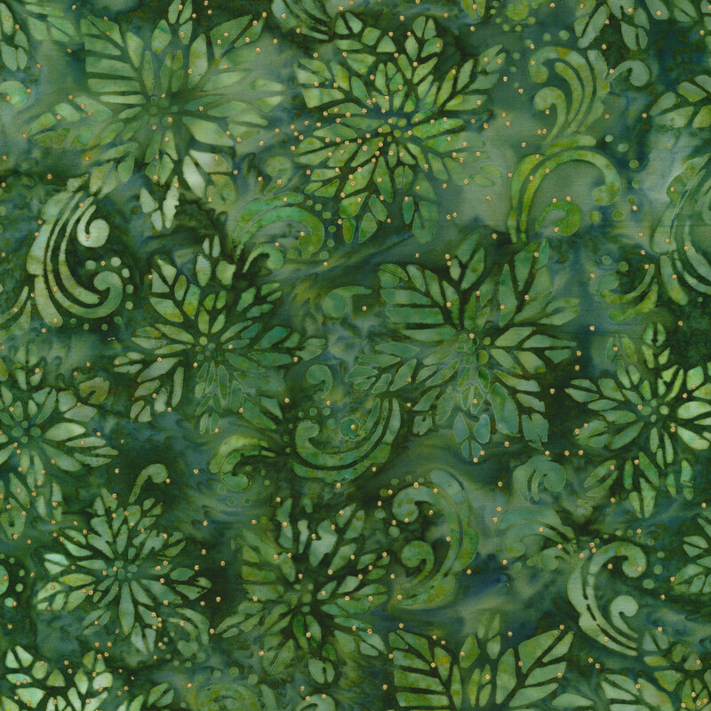 Green mottled batik fabric with a green poinsettia design and swirls with gold metallic dots.