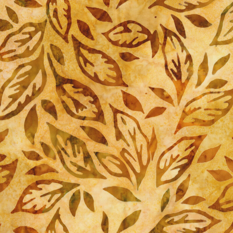golden yellow mottled fabric featuring scattered leaves in shades of mottled orange and brown