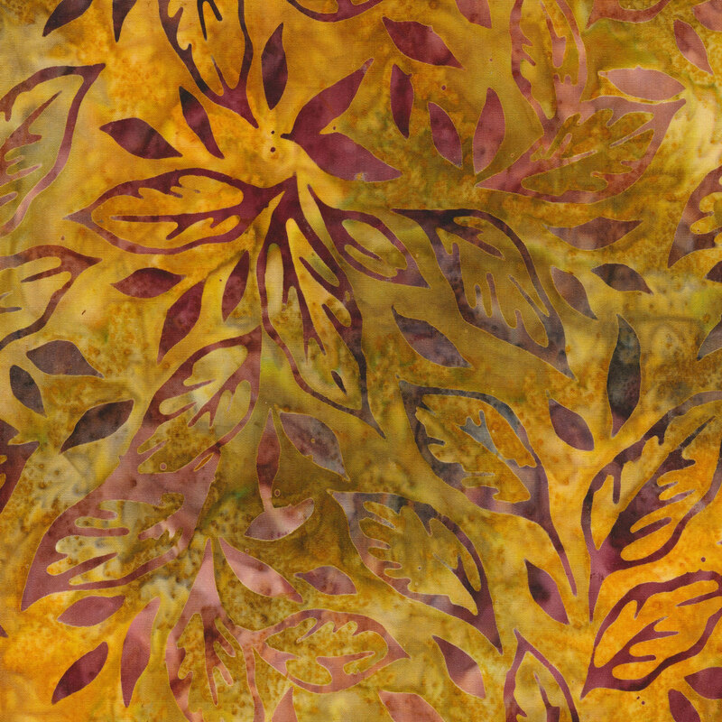 dark olive green and orange mottled fabric featuring scattered leaves in shades of mottled maroon and brown