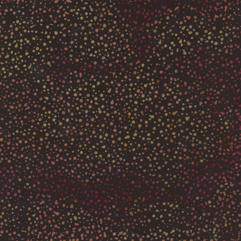 Dark fabric with light, mottled dots all over ranging from dark magenta to yellow